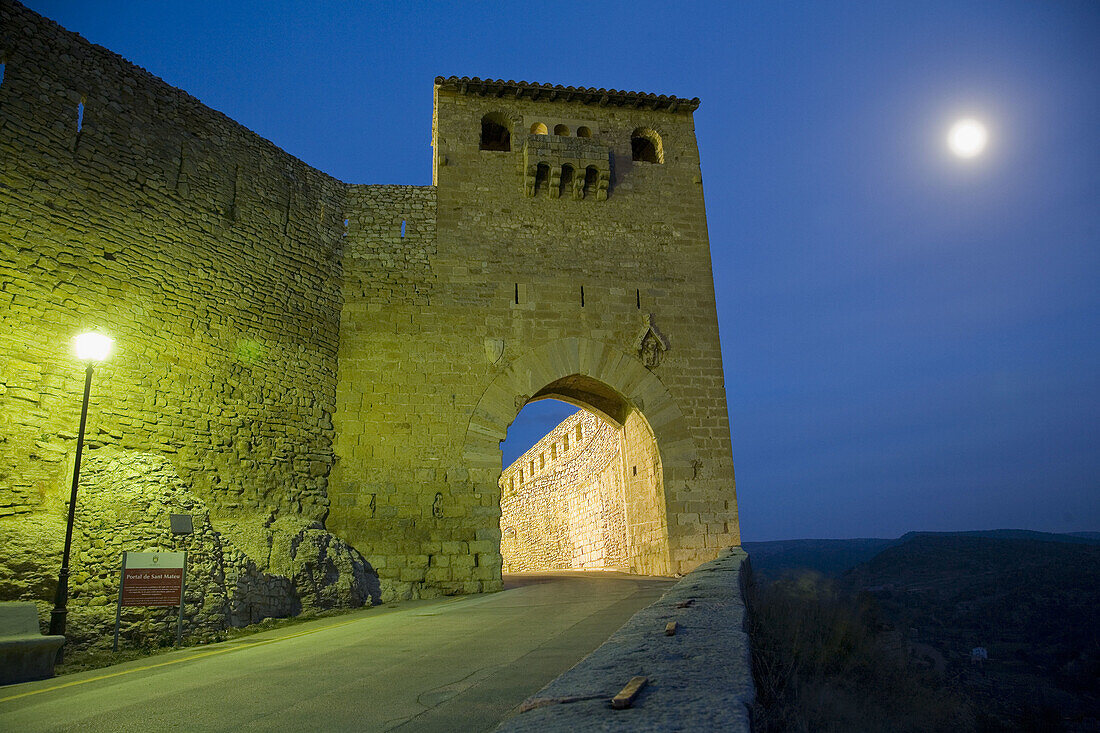 Portal de Sant Mateu and city walls at night. . Els Ports. Castellón province. Valencia. Spain