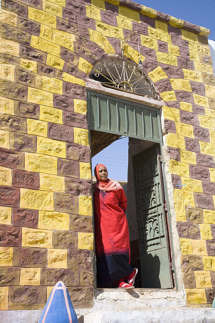 Nubian woman on the door of her house. Nubian Village. Aswan. Egypt.