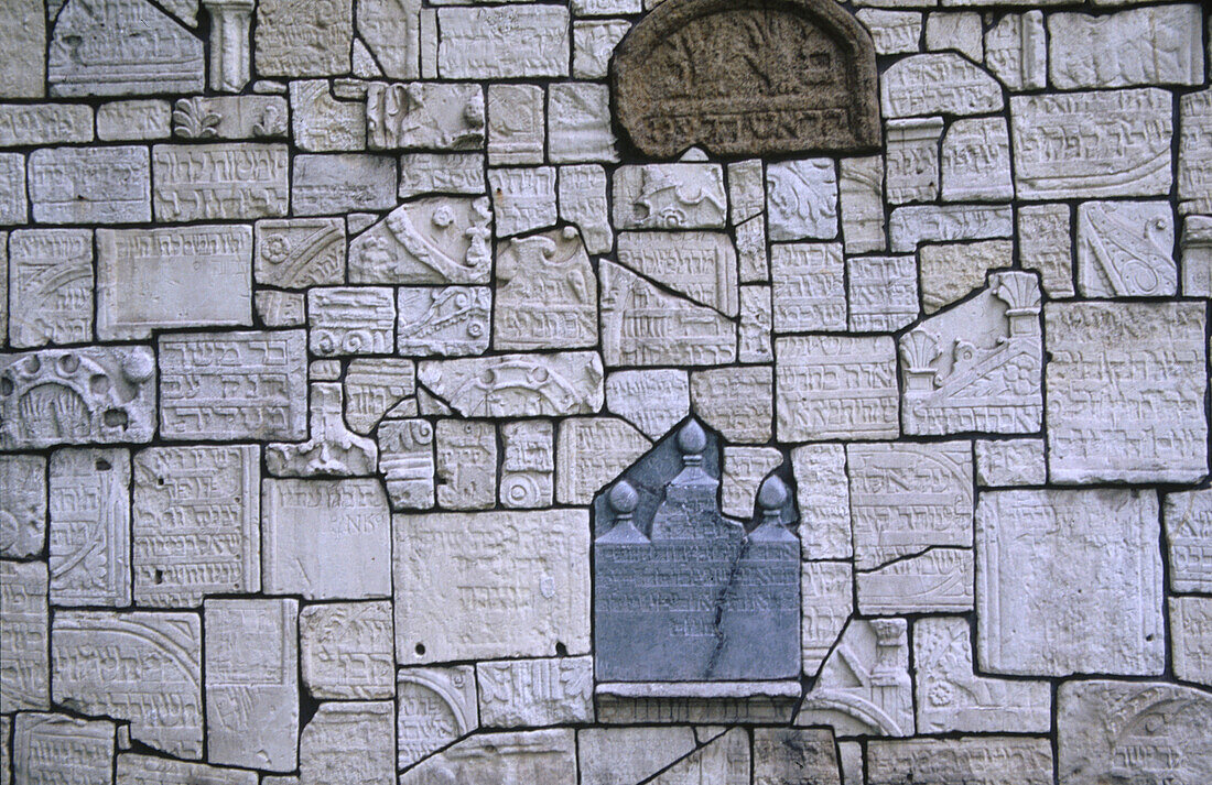 Wall made from nazi desecrated tombstones. Remuh Synagogue cemetery. Jewish quarter. Kazimierz. Krakow. Poland