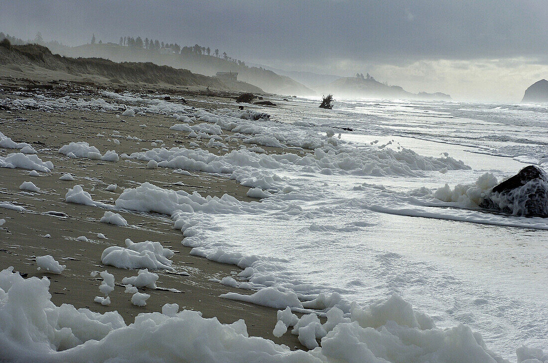 Foam created by stormy ocen pacific ocean near Pacific City, Oregon