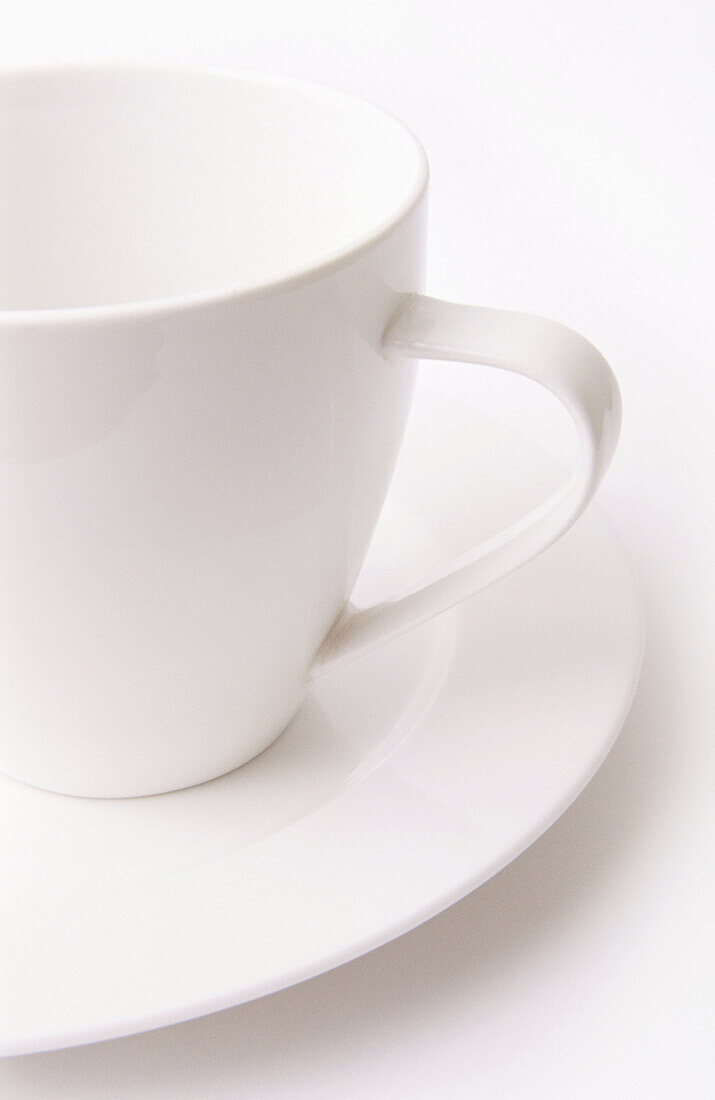 High key white tea cup and saucer on clean white background