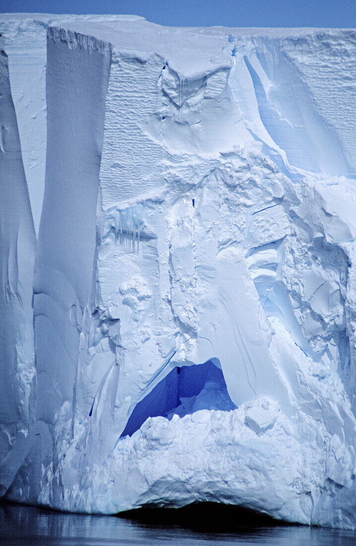 Face of the Ross ice shelf: this piece is about to fall off and also looks like a mans face frowning. Ross Sea, Antarctica