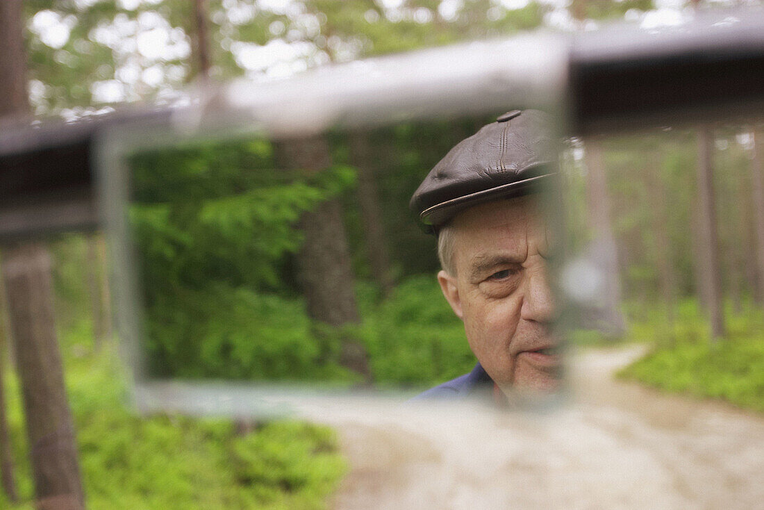 Man in old T-Ford 1923 driving on gravel way. Hudiksvall. Hälsingland. Sweden