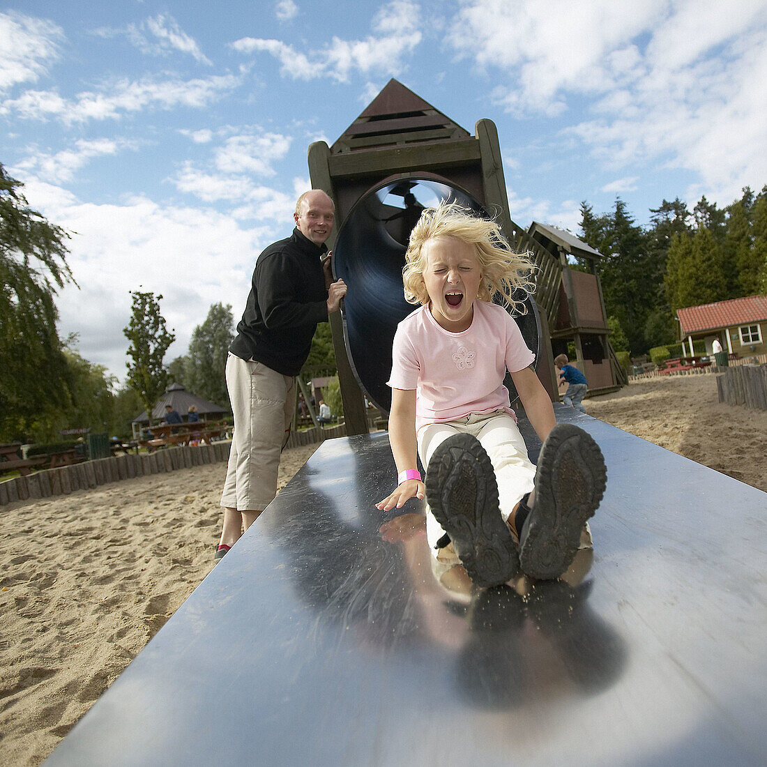 Daughter and father playing in playground. Danmark