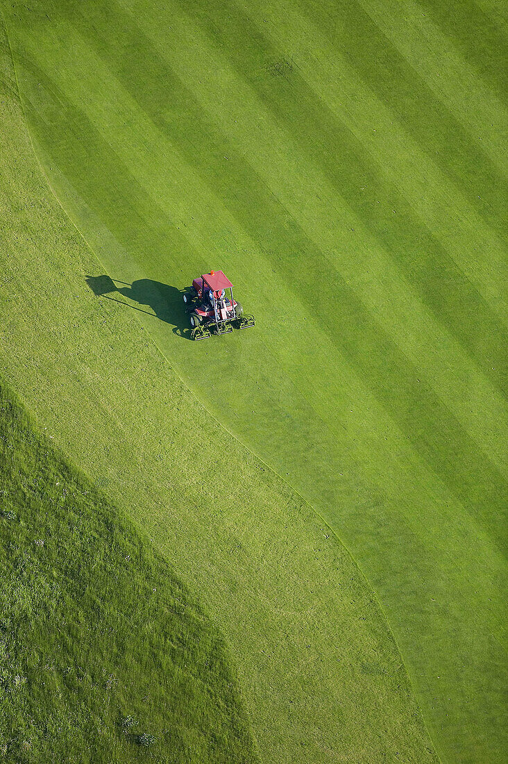 Grass klipper on Golf court, aerial view. Stockholm, Sweden