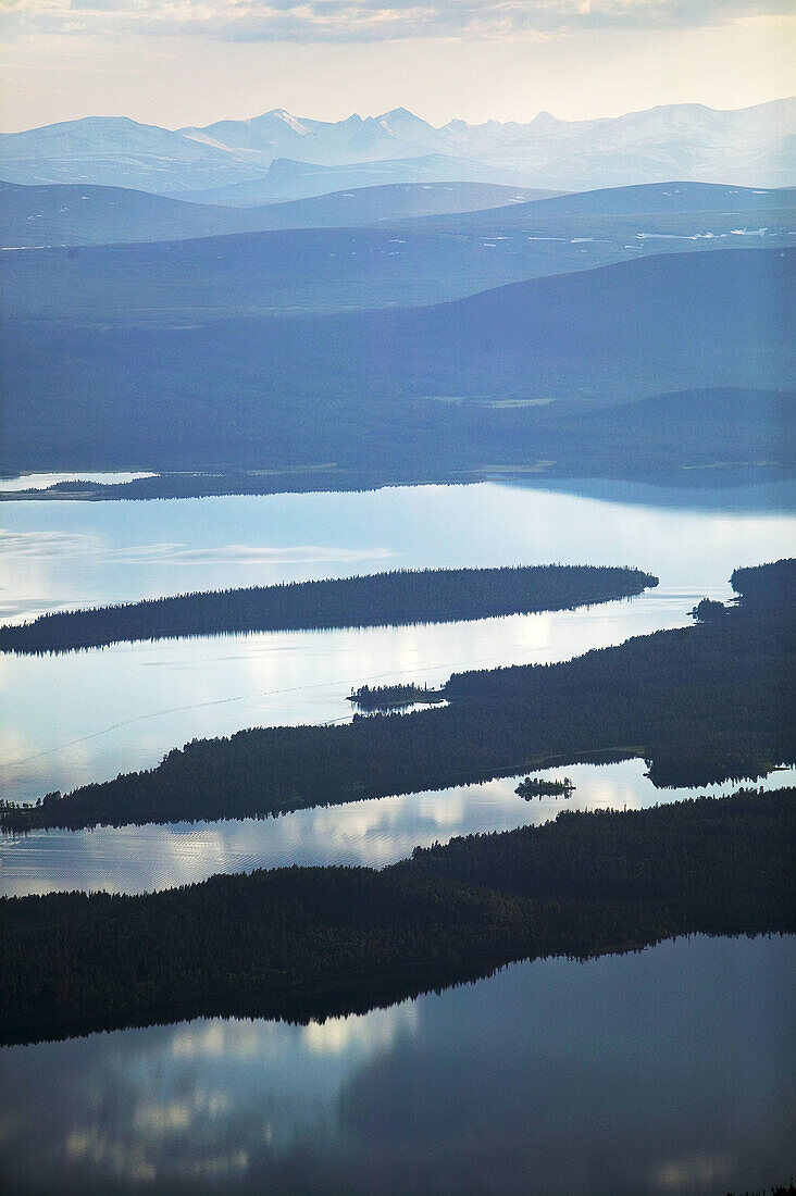 Lake in front of mountain area, forest, aerial view.Stora lulevatten. Lappland. Sweden