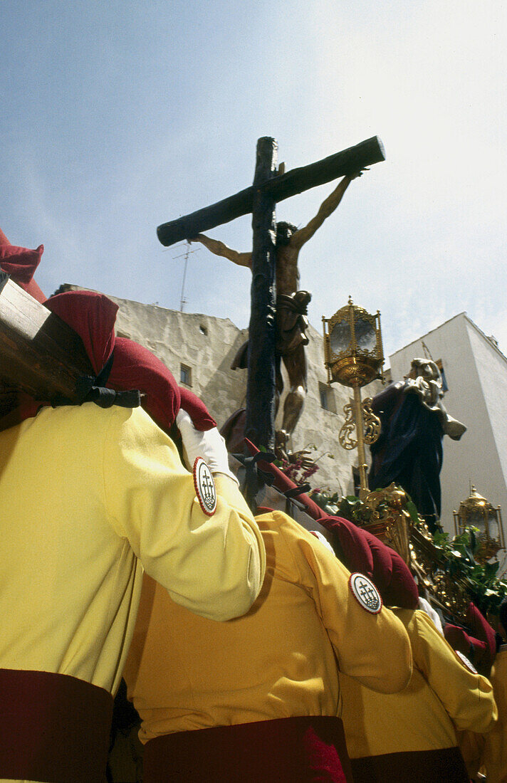 Penitents carrying float during Holy Week procession, Cuenca. Castilla-La Mancha, Spain