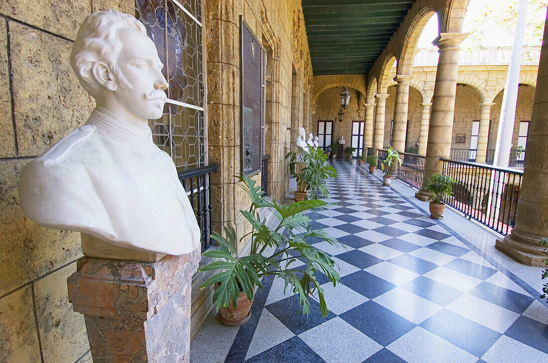 Palacio de los Capitanes Generales.  View of the second-floor gallery overlooking the central courtyard.  The gallery features several busts of historical figures. Havana, Cuba
