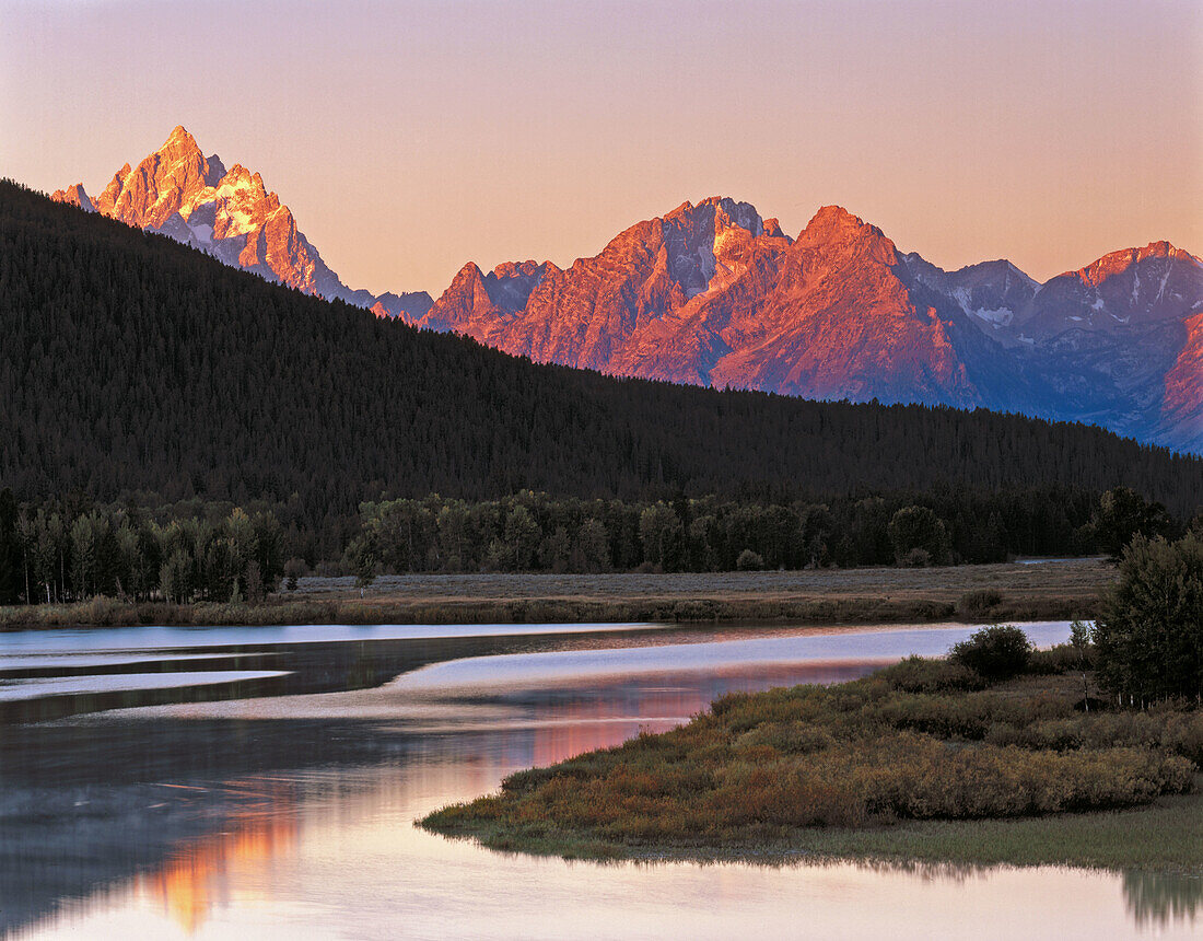 Dawn over the Teton Range from the Oxbow Bend of the Snake River. Grand Teton National Park. Wyoming. USA