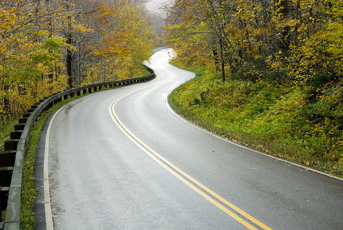 Rural road winding through Smugglers Notch Vermont USA