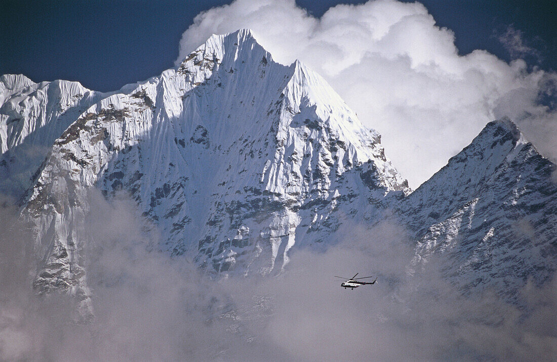 Helicopter flying over Himalayas. Khumbu, Nepal.