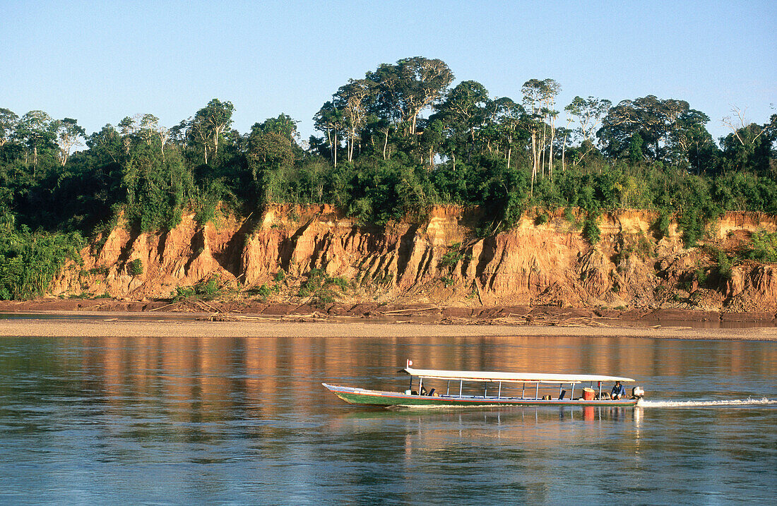 Tambopata river and colpa (mud terrace) with Macaws. Tambopata National Reserve, Peru