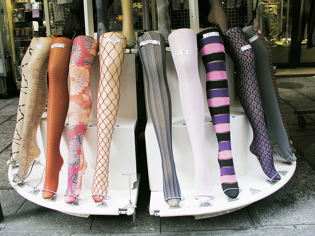 Paris, France: A display of womens stockings in a storefront.