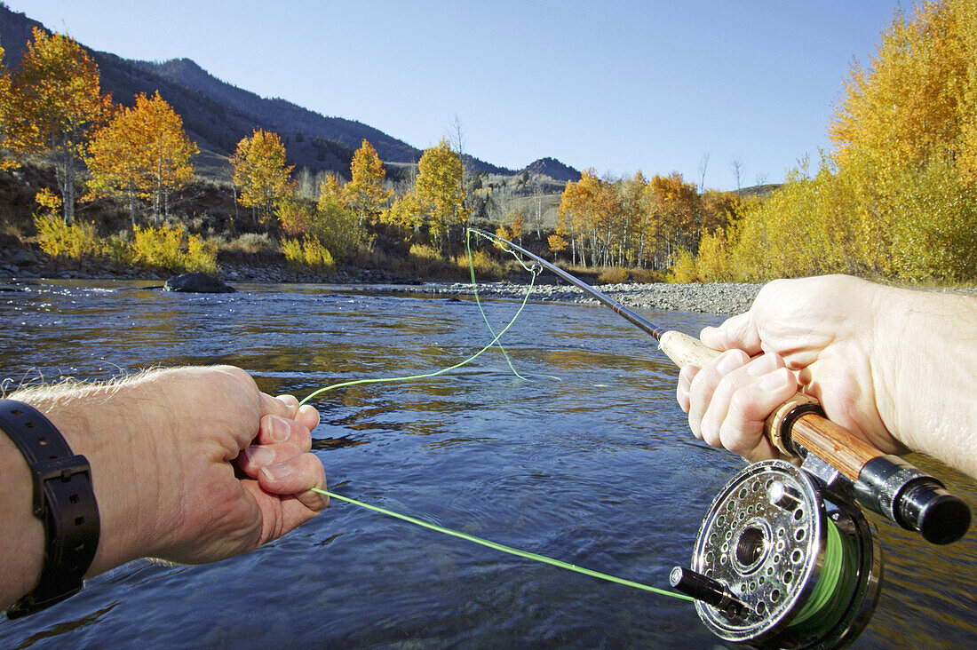 Point of view flyfishing on Big Wood River in Sun Valley, Idaho. USA