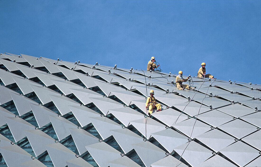 Workers on the rooftop of the Esplanade. Singapore