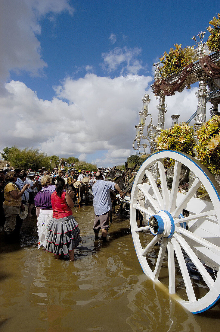 Pilgrims singing prayers in Guadiamar river. Quema river ford. El Rocío road. Vado del Quema. Huelva province, Andalusia, Spain