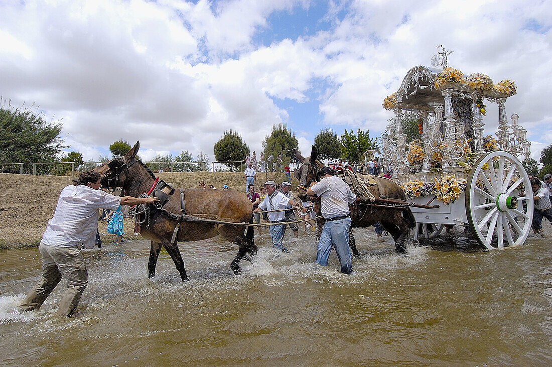 Pilgrims to El Rocío crossing Quema River. Huelva province, Andalusia, Spain