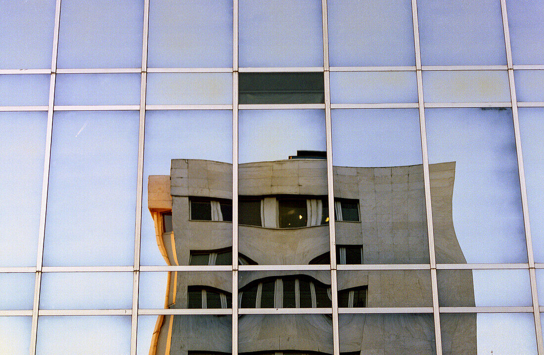 Building reflected on façade. Paseo de la Castellana, Madrid, Spain