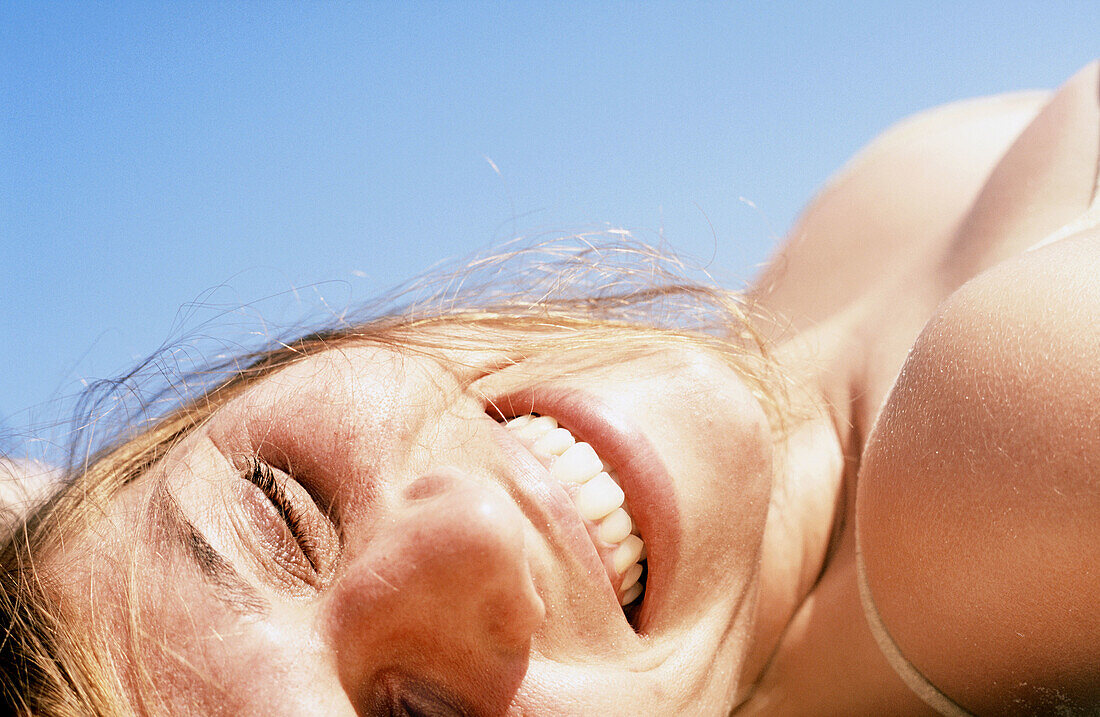 Young woman relaxing on the beach