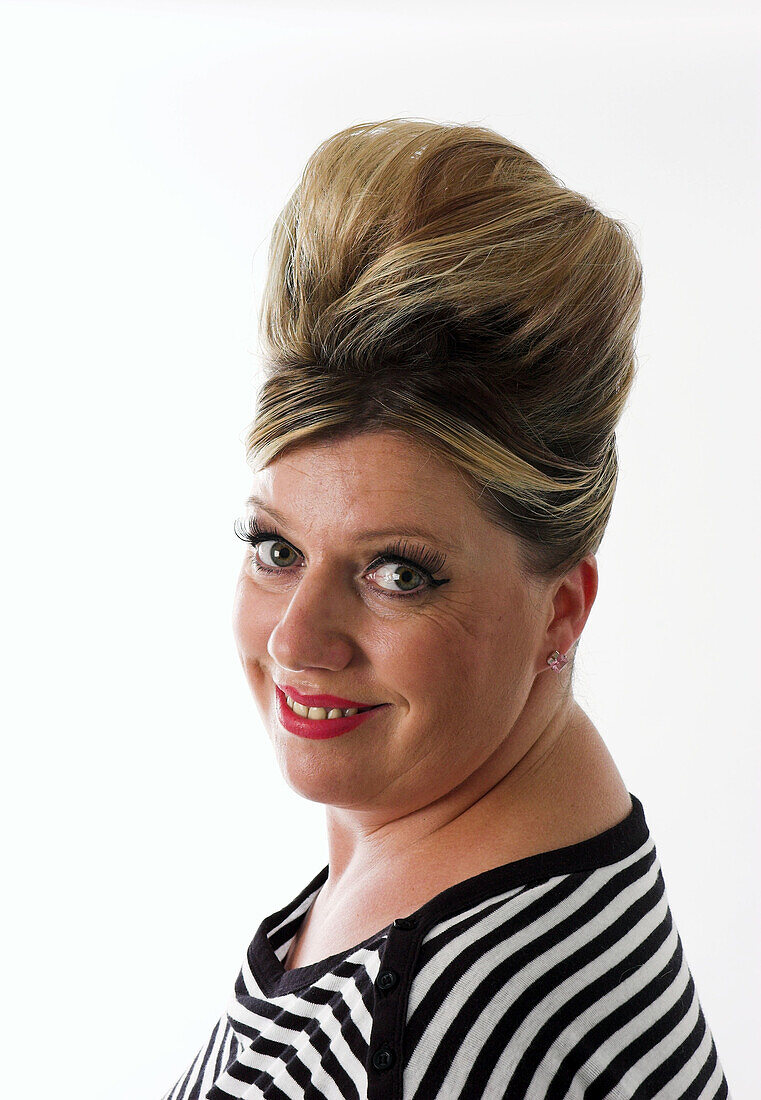 Glamourous woman with 1950s style beehive hairstyle.