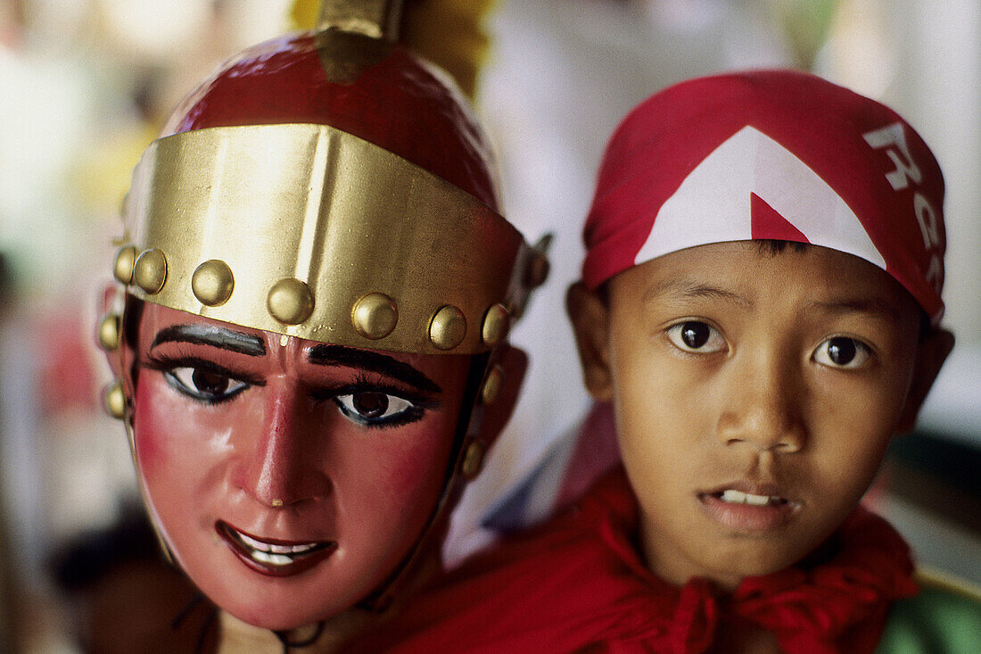 Little boy with soldier mask. Philippines.