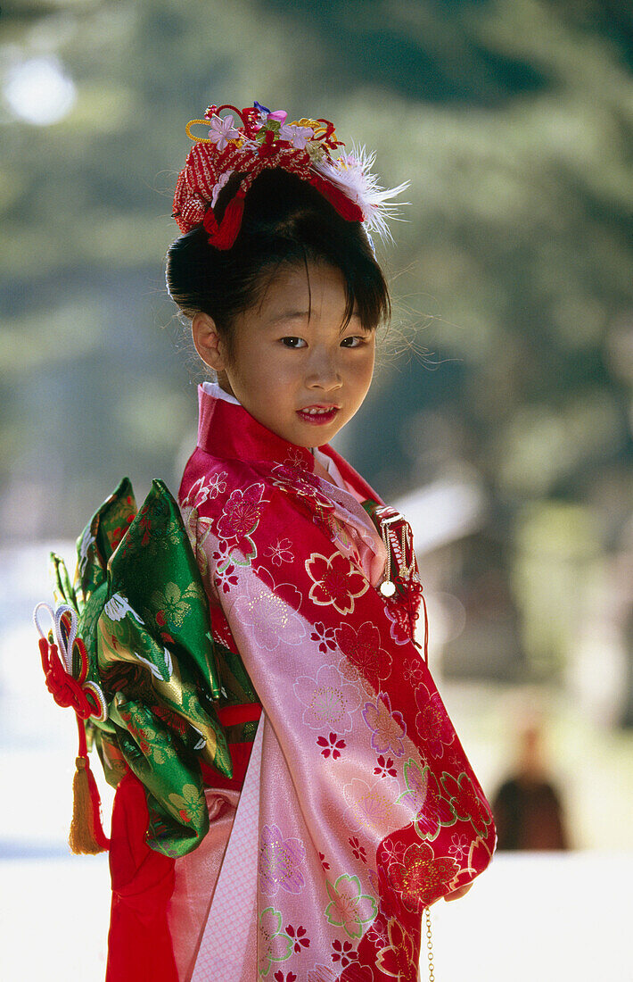 7 year old girl wearing kimono, Kitano Temmangu Shrine. Kyoto, Japan