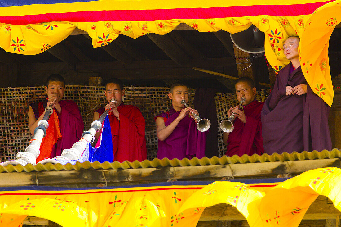 Musicians playing horns during the Paro Tsechu (festival), Paro, Bhutan
