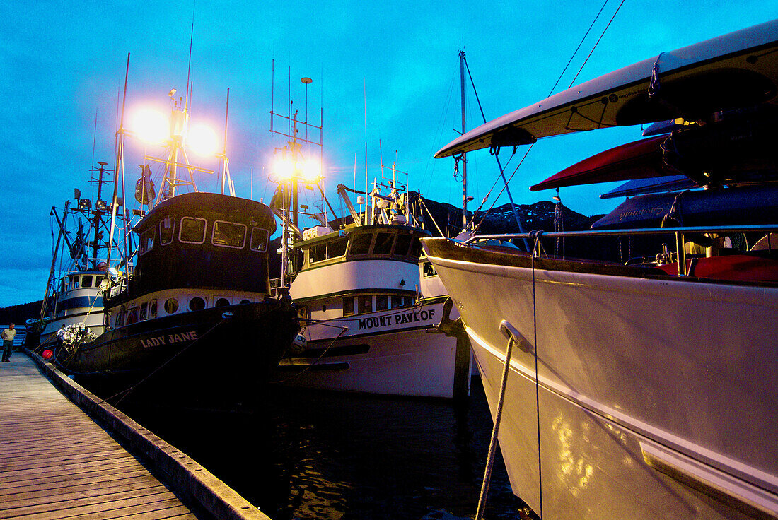Twilight view of the Ursa Major and fishing boats docked at  Baranof Warm Springs, Baranof Island, Southeast Alaska