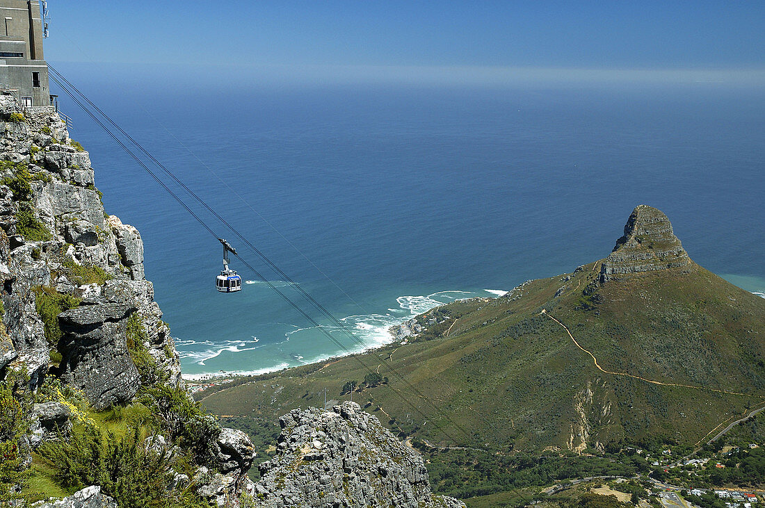 Cable car running from the summit of Table Mountain down past the Lions Head, Table Mountain National Park, Cape Town, South Africa