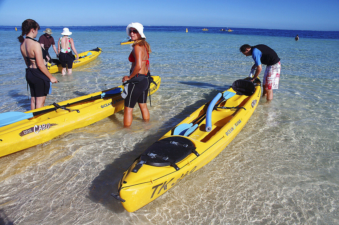 Ecotourists setting off in hired seakayak towards Ningaloo Marine Park, Coral Bay, Western Australia.