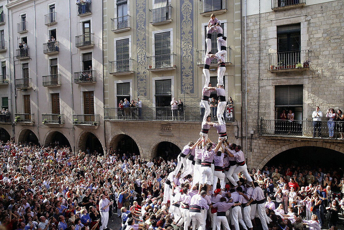 Castellers building human towers, a Catalan tradition. Girona, Catalonia, Spain