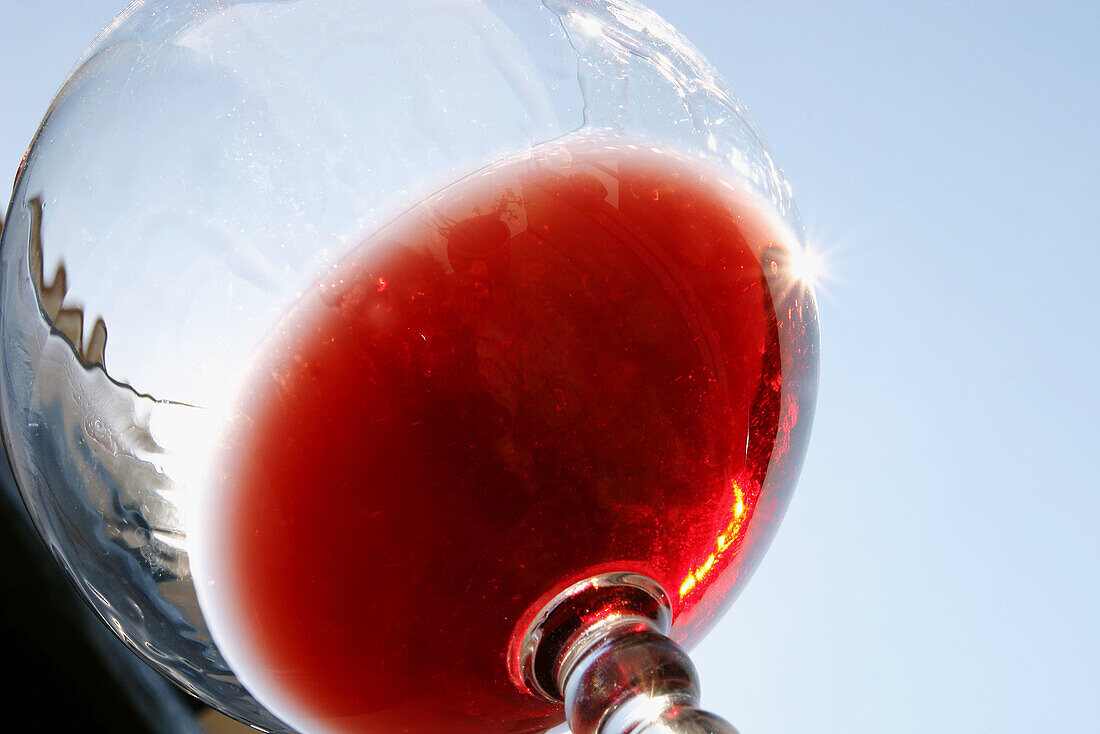 Glass of wine against Mediterranean sky. Begur. Girona. Costa Brava. Catalunya. Spain.