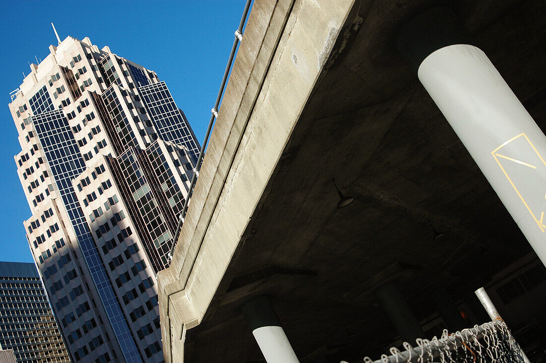 Highway overpass with high rise building in urban downtown setting. San Francisco. California. USA.