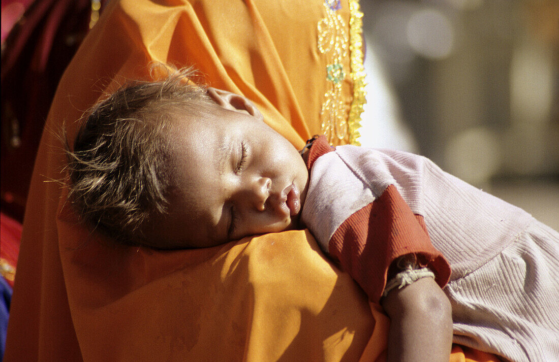 Sleeping Baby. Pushkar Camel Festival. Pushkar. Rajasthan. India