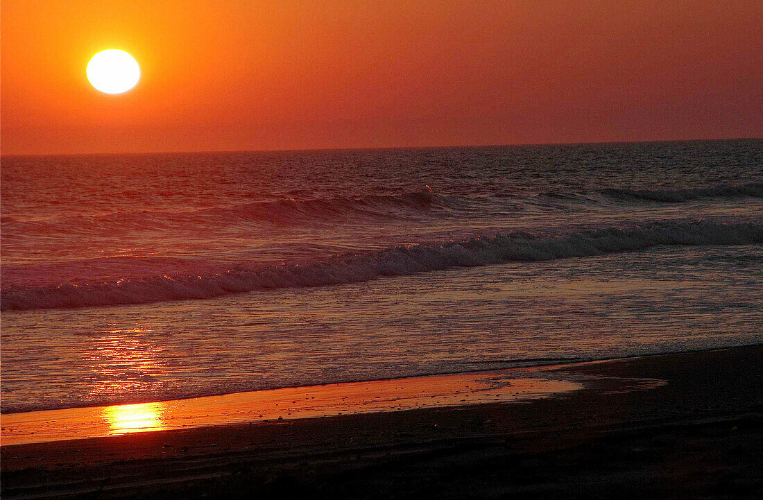 a sunset on the famous and desertic Skeleton Coast in Namibia