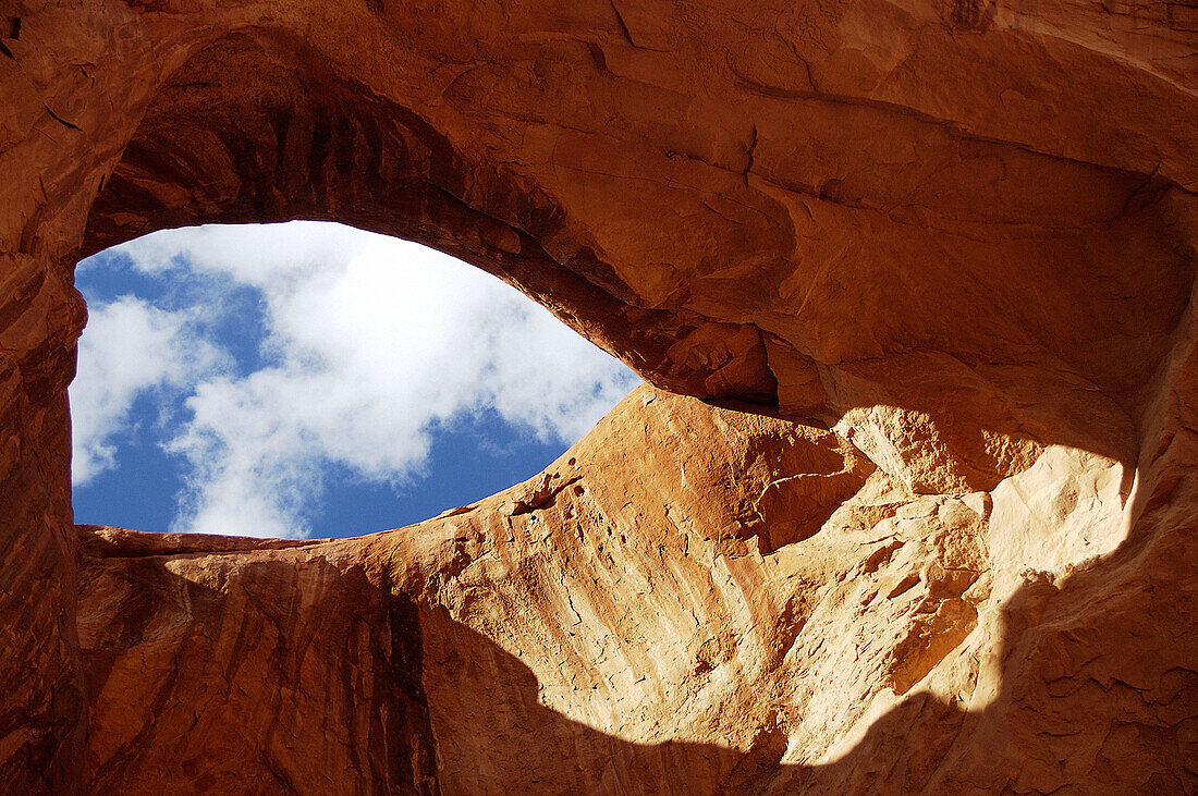 A hole in the rock in the Monument Valley perfectly shaped like an eye. Utah/Arizona, USA