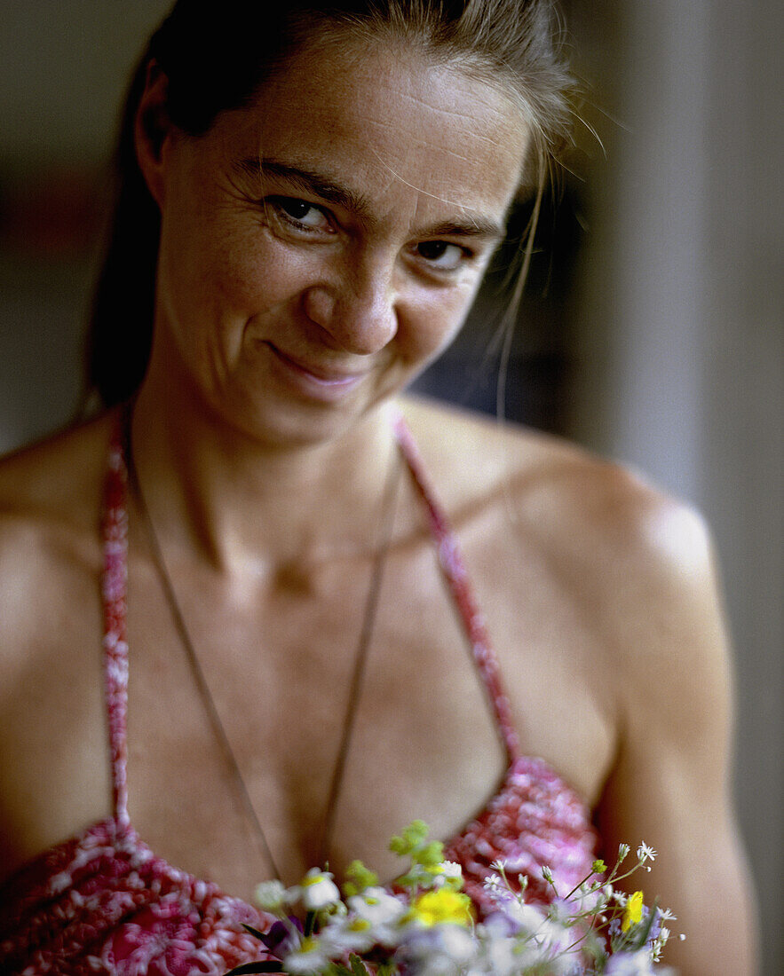 Mature woman smiling at camera, Burg-Kauper, Upper Spreewald, Brandenburg, Germany