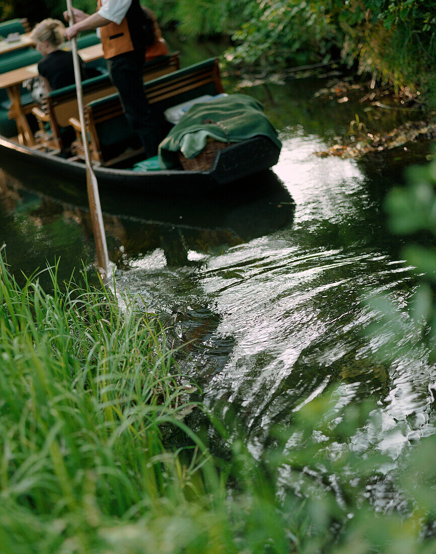 Tourists in rowing boats on river in Spreewald, Brandenburg, Germany