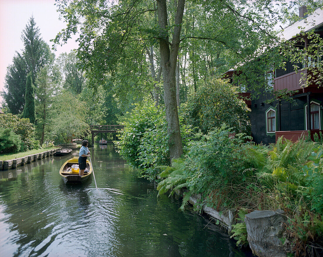 Jutta Prudenz, Germany`s only postwoman, who uses a punt to deliver mail; here in village of Lehde, Upper Spreewald, Spreewald, Brandenburg, Germany