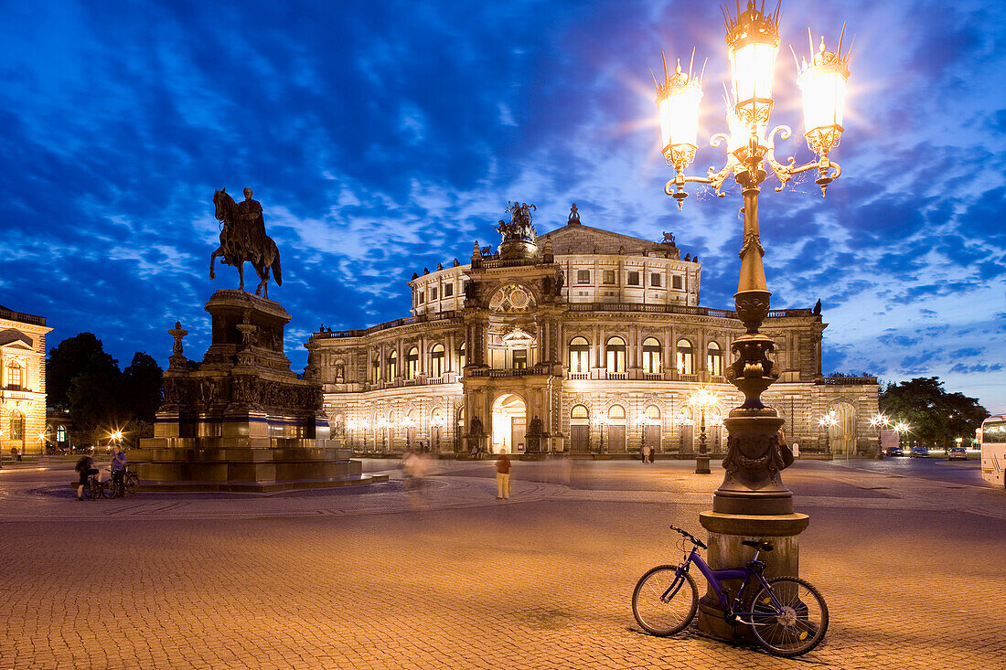 Theater square with Semperoper and King John monument at night, Dresden, Saxony, Germany