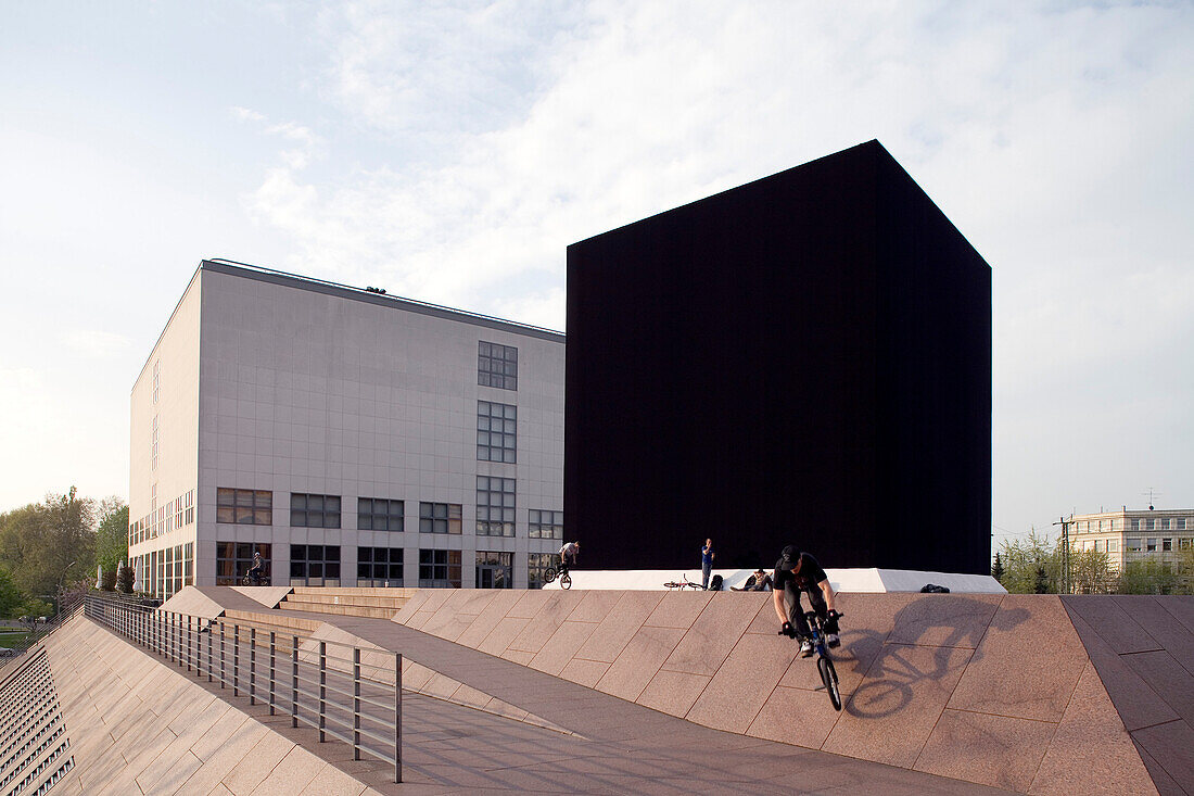Gregor Schneider's The Black Cube in Hamburg. It is one of Germany's most contended artwork at present. The cube, placed between the original building of the museum 'Kunsthalle' and its new gallery, is a reminder of the major sanctuary of Islam, the Kaaba