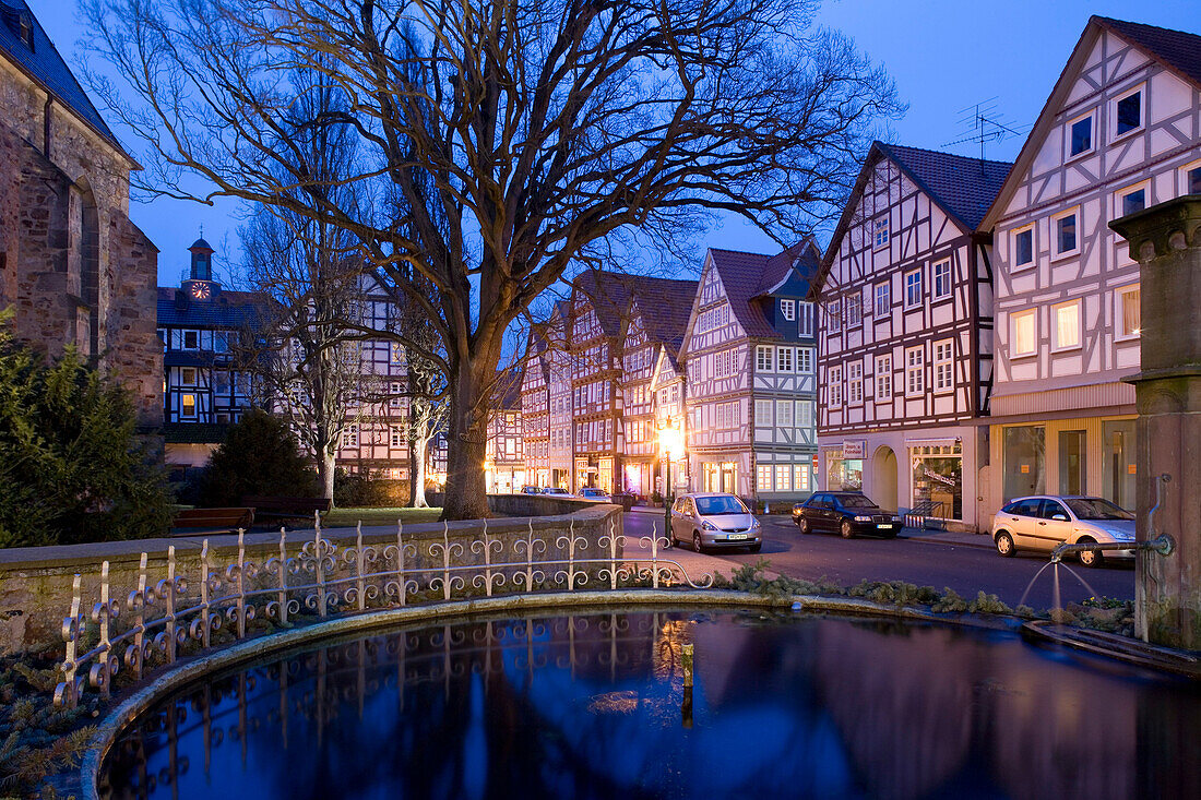 Fountain and half-timbered houses at Melsungen in the evening, Melsungen, Hesse, Germany, Europe