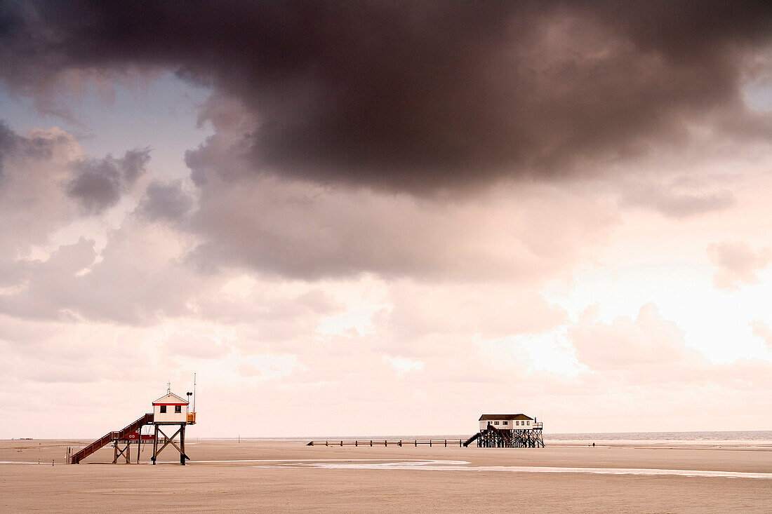Stilted houses at beach, St. Peter-Ording, Schleswig-Holstein, Germany