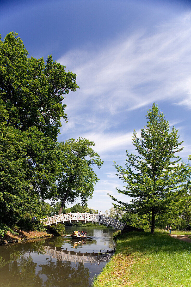 Visitors in a gondola passing White Bridge, Dessau-Worlitz Garden Realm, Saxony Anhalt, Germany