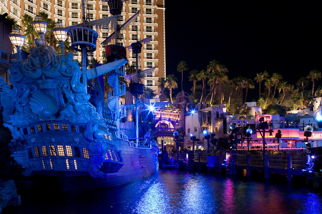 A pirate ship illuminated outside the Treasure Island Hotel and Casino in Las Vegas, Nevada, USA
