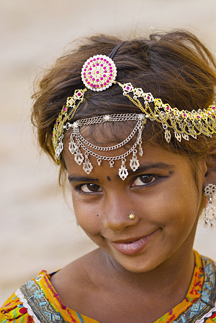 Girl with ornate jewelry in her hair, Jaisalmer Fort, Jaisalmer, Rajasthan, India
