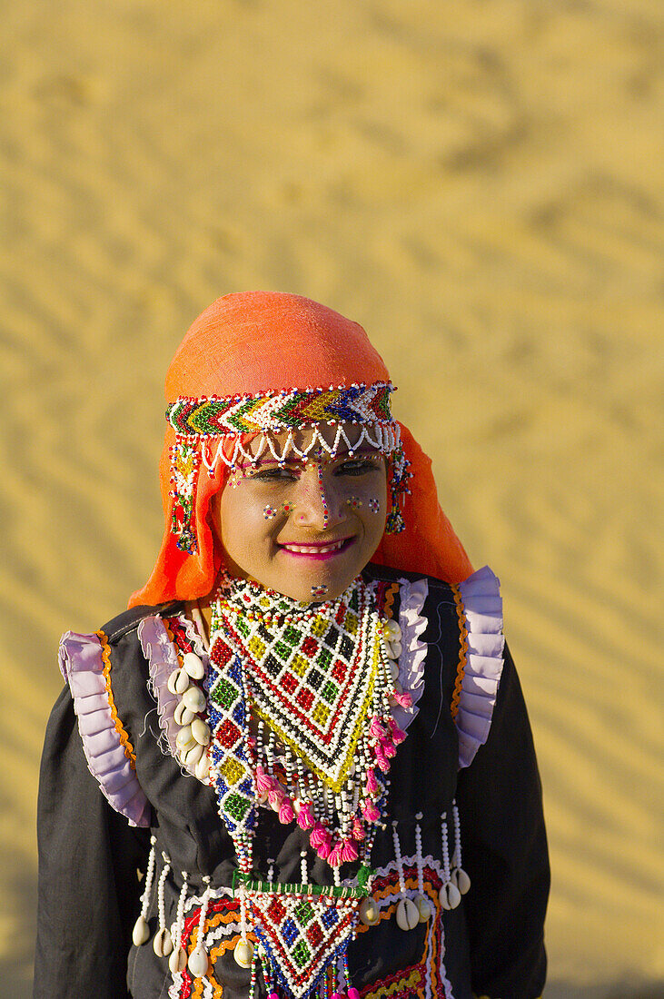Girl wearing traditional Rajasthani desert costume, Kanoi Sand Dunes, Thar Desert, near Jaisalmer, Rajasthan, India