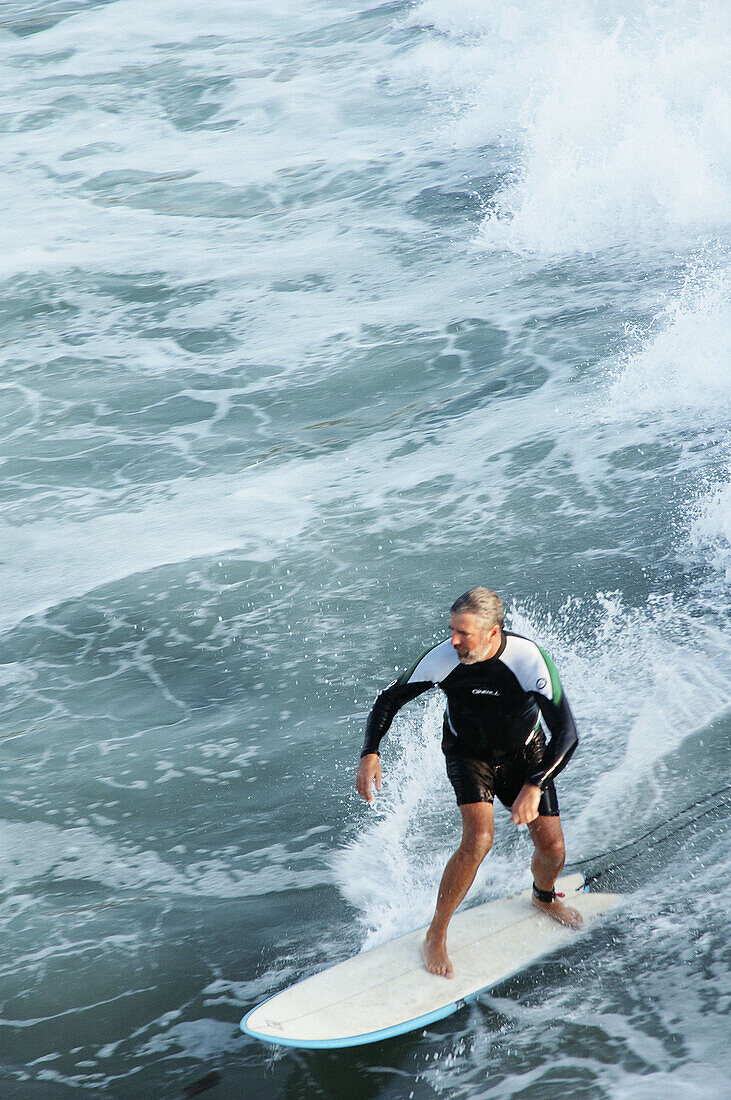 Senior surfing. Baja California. Mexico.