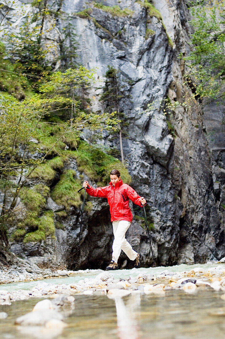 Woman hiking in gorge, Garmisch Partenkirchen, Bavaria, Germany