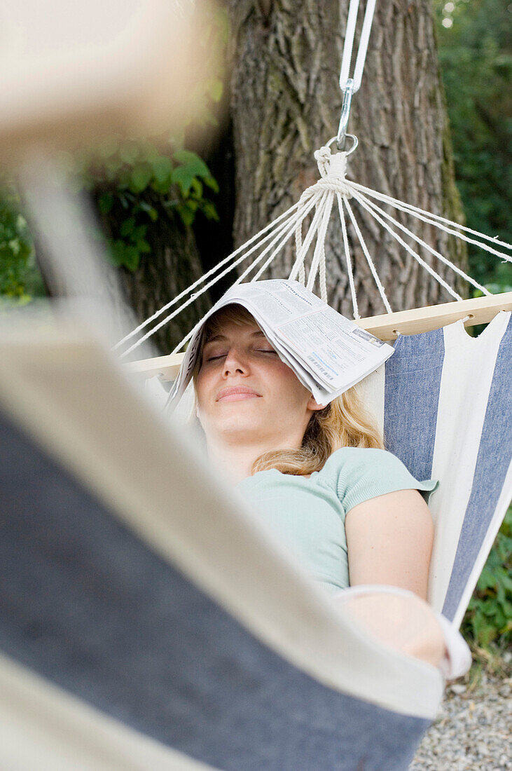Mid adult woman resting in hammock